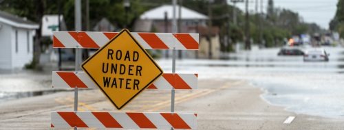 A road sign warns that the upcoming street is flooded as a result of a severe thunderstorm in the metro Atlanta area.